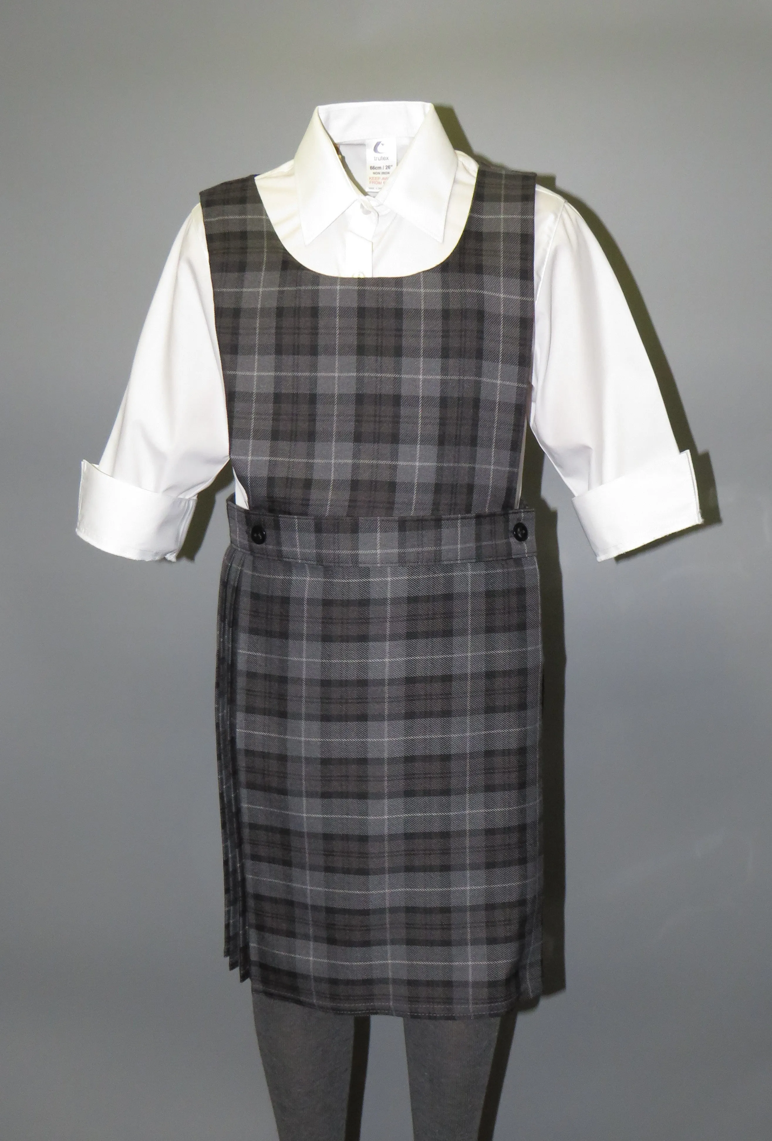 Girls school bib tartan pinafore with button detail - Quality school uniforms at the School Clothing Company